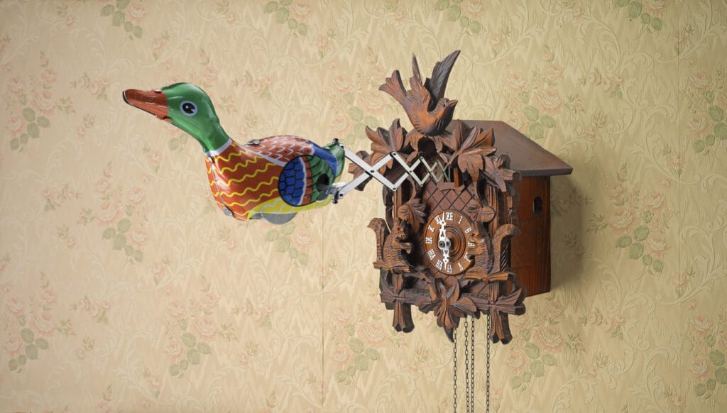 Retro Tin Toy Duck coming out of Cuckoo Clock on spring