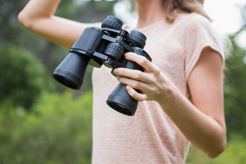 Woman holding binoculars