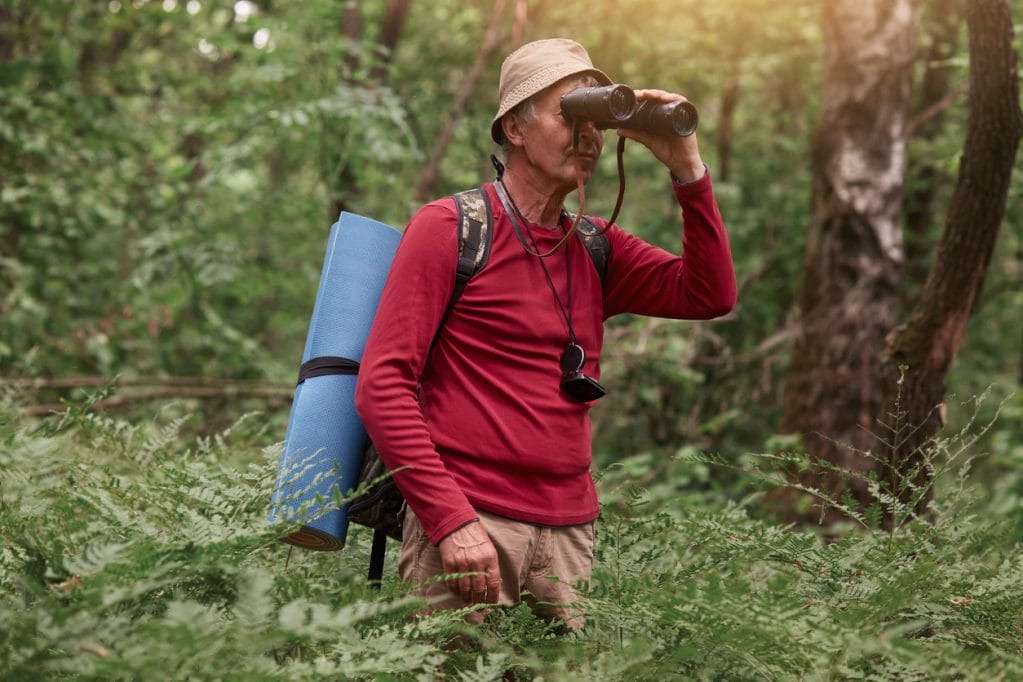 man birdwatching binoculars